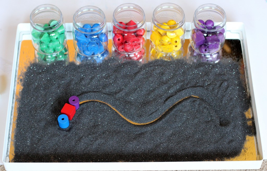Glitter sand tray with Spielgaben manipulatives